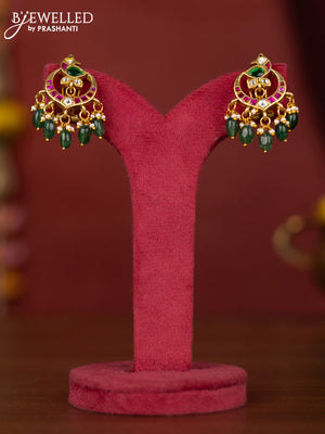 Jadau peacock earring with jadau kundan stones and green beads hanging