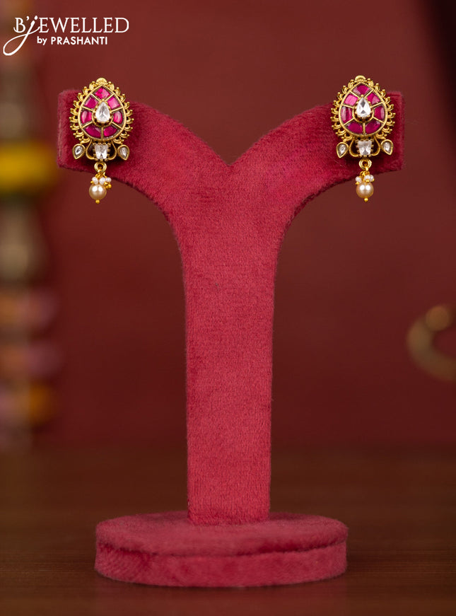 Jadau leaf floral design earring with pink jadau stones and pearl hanging