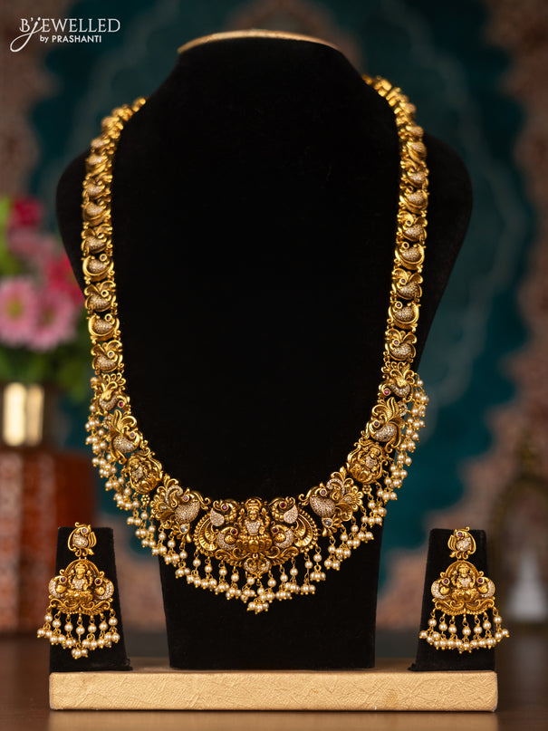 Antique haram lakshmi design with pink kemp & cz stones and pearl hangings