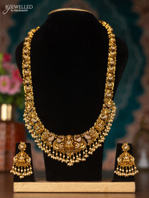 Antique haram lakshmi design with pink kemp & cz stones and pearl hangings