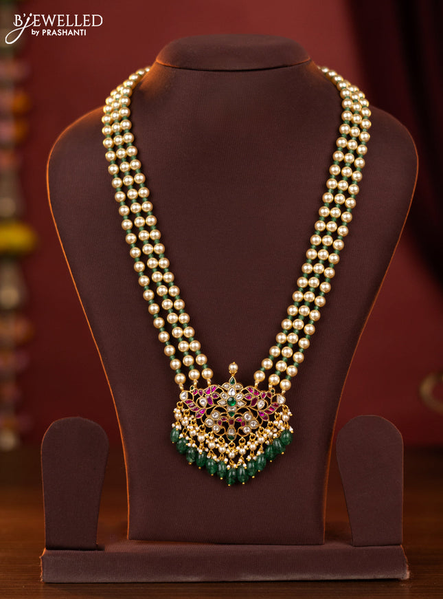 jadau pearl haaram with jadau kundan floral pendant  and green beads hanging