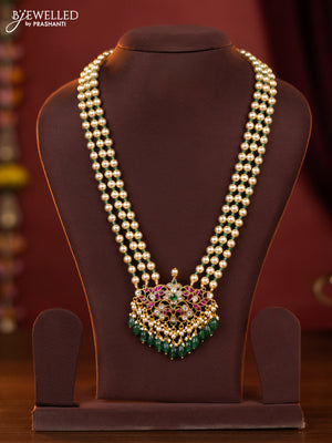 jadau pearl haaram with jadau kundan floral pendant  and green beads hanging