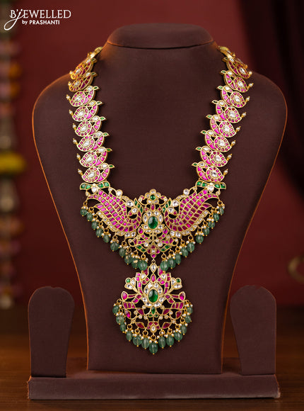 jadau peacock design haram with jadau kundan stones and green beads hanging