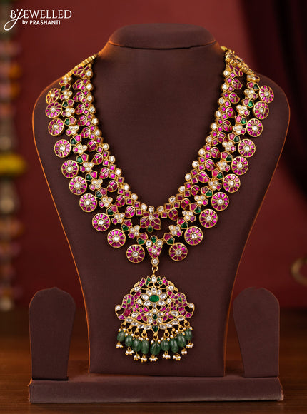 Jadau double layer bottumala maanga haaram with double peacock pendant in jadau kundan stones and green beads haging