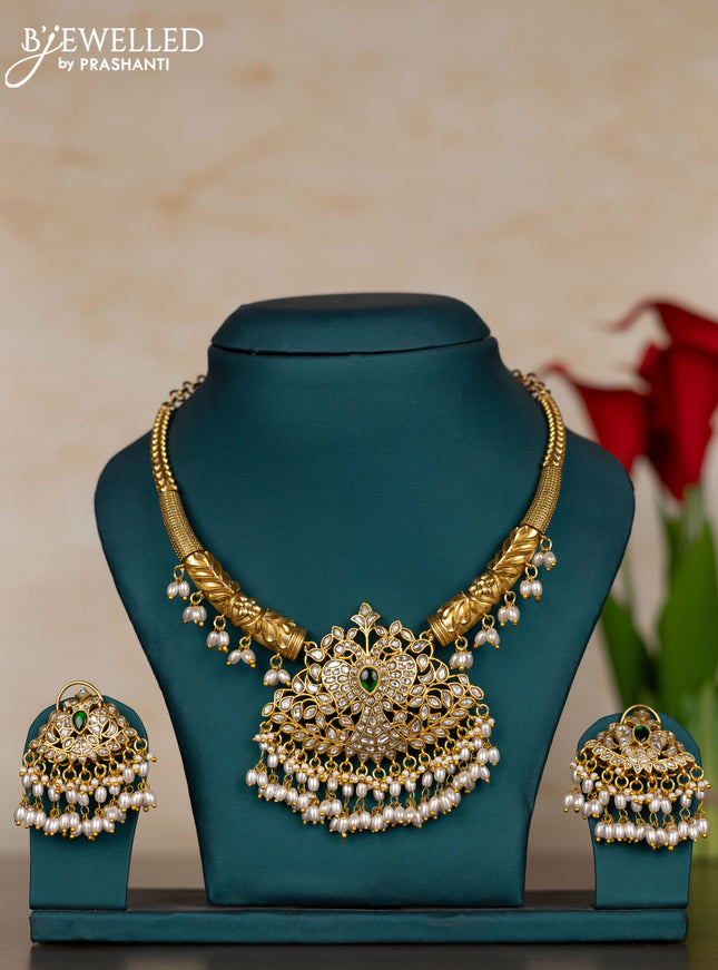 Jadau necklace peacock design with green jadau kundan stones and pearl hangings