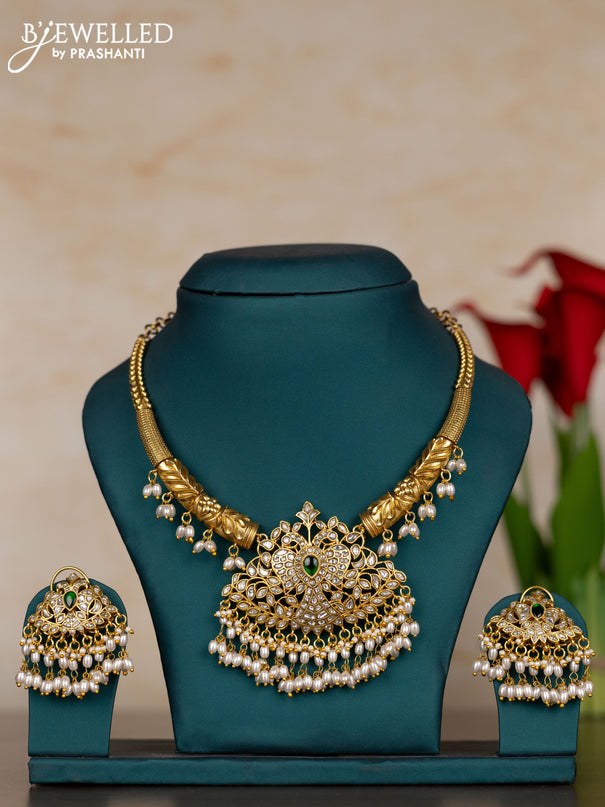Jadau necklace peacock design with green jadau kundan stones and pearl hangings