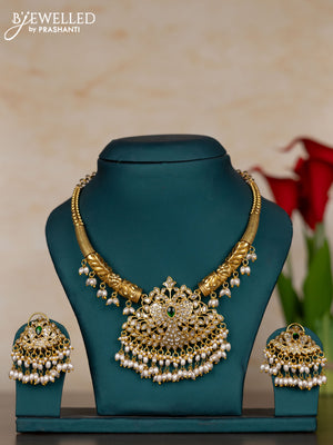 Jadau necklace peacock design with green jadau kundan stones and pearl hangings