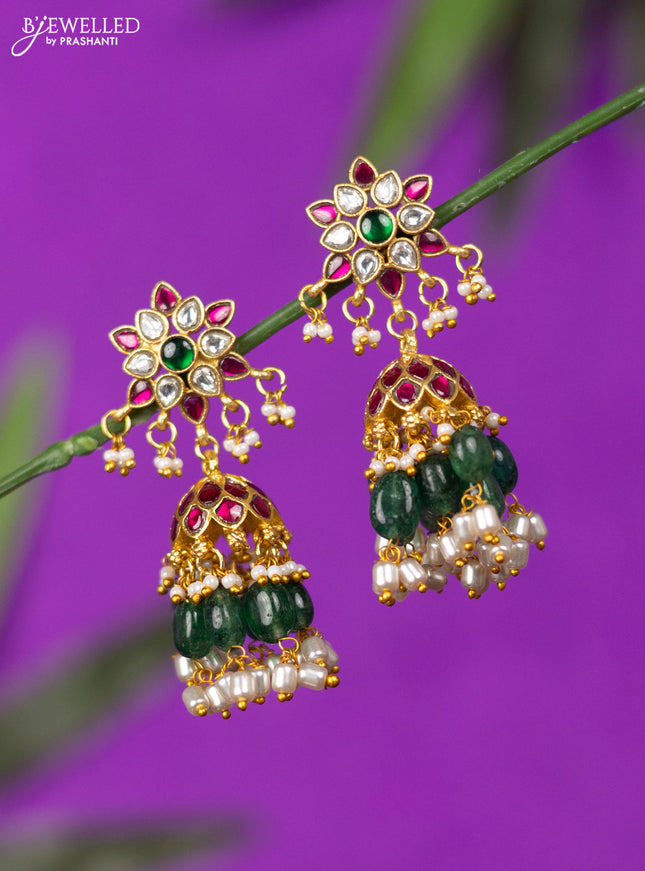 Jadau screw type jhumka with kemp jadau kundan stones and mint green beads hangings