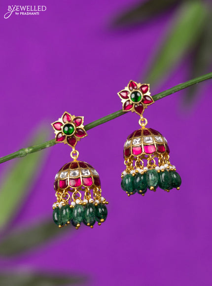 Jadau screw type jhumka with kemp jadau kundan stones and green beads hangings