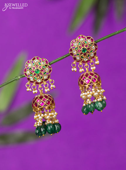 Jadau screw type jhumka with kemp jadau kundan stones and green beads hangings