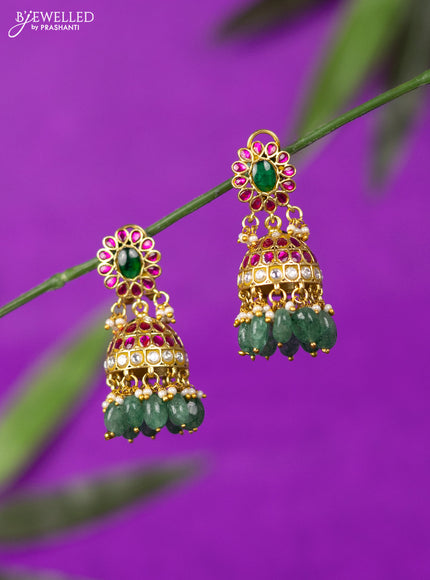 Jadau screw type jhumka with kemp jadau kundan stones and mint green beads hangings