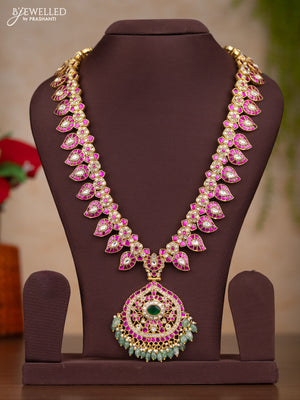 Jadau haaram with manga design with floral pendant in jadau kundan stones and mint green hanging