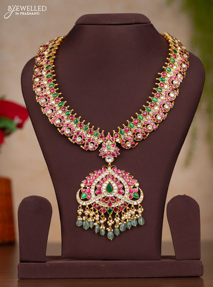 Jadau haaram with manga design with floral pendant in jadau kundan stones and mint green hanging