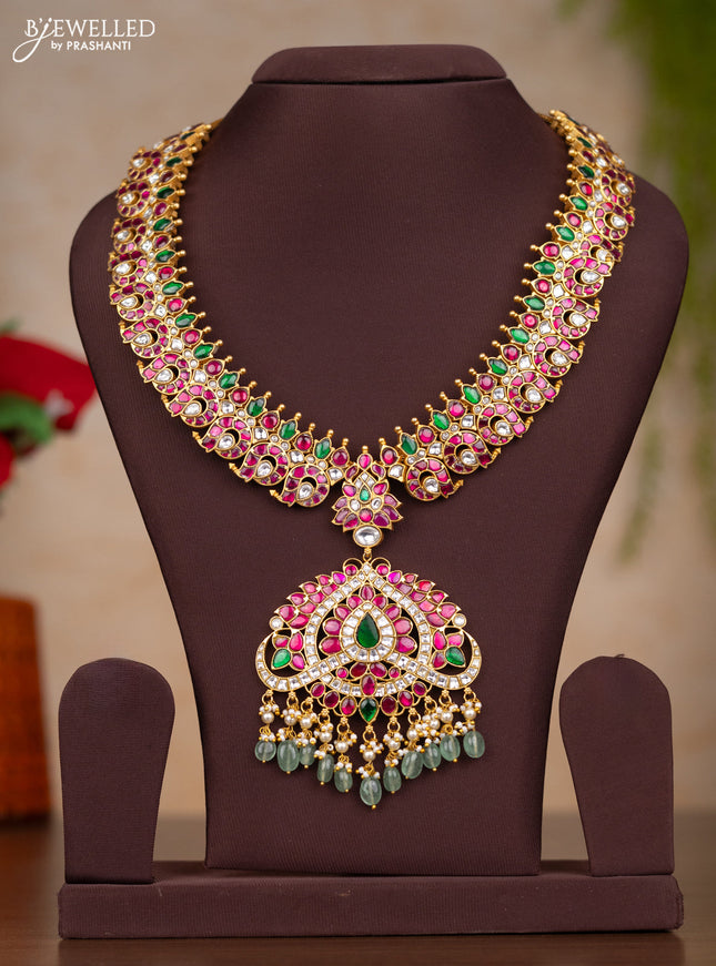 Jadau haaram with manga design with floral pendant in jadau kundan stones and mint green hanging