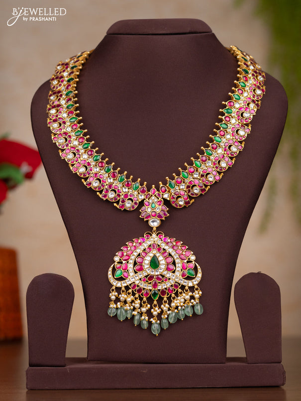 Jadau haaram with manga design with floral pendant in jadau kundan stones and mint green hanging