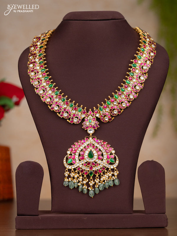 Jadau haaram with manga design with floral pendant in jadau kundan stones and mint green hanging