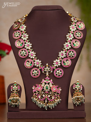 Jadau haaram bottumala with floral deisgn through out the neckline and pendant in floral with mint green beads hanging