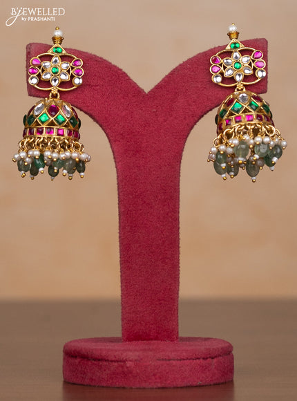 Jadau haaram bottumala with floral deisgn through out the neckline and pendant in floral with mint green beads hanging