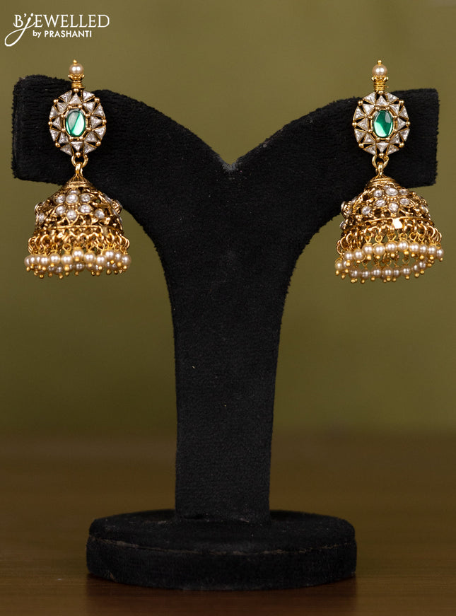 Antique necklace with floral design in kundan stones and pearl throughout the neckline
