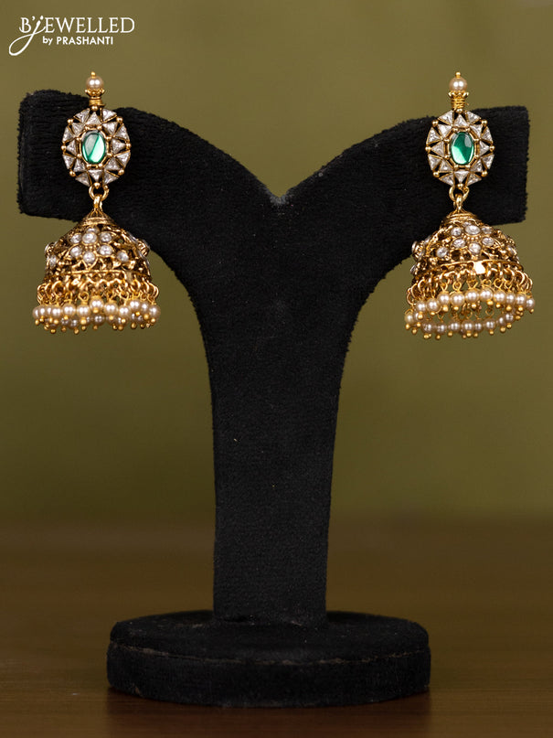 Antique necklace with floral design in kundan stones and pearl throughout the neckline