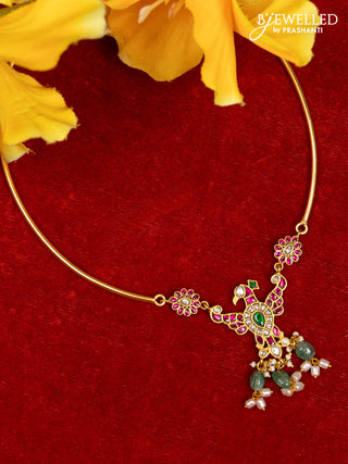 Ring type choker with eagle pendant in jadau kundan stones and green beads hanging