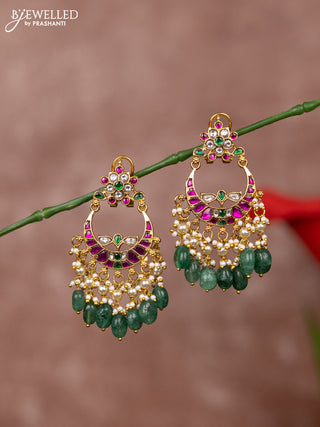 Jadau earrings floral deisgn with jadau kundan stones and green beads hanging