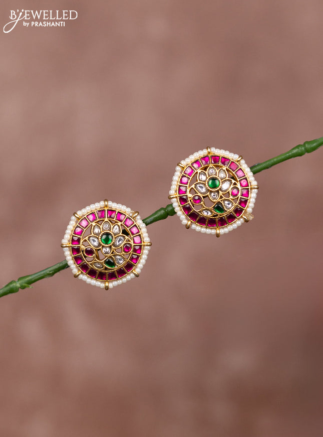 Jadau earrings floral deisgn with jadau kundan stones surrounded with white beads
