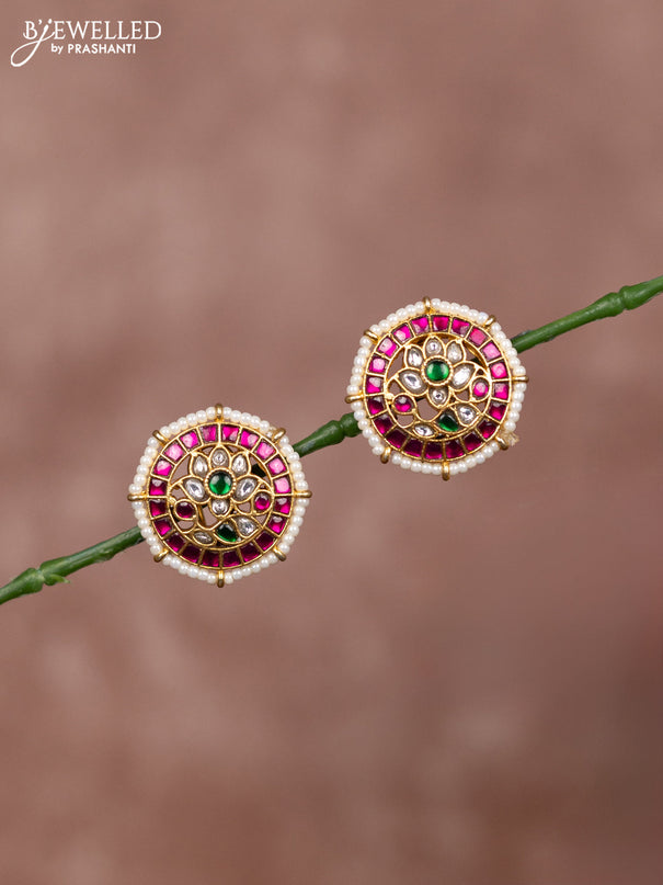 Jadau earrings floral deisgn with jadau kundan stones surrounded with white beads