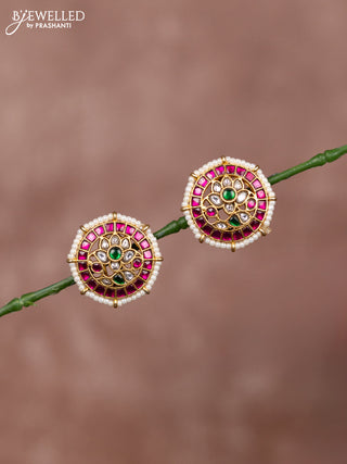 Jadau earrings floral deisgn with jadau kundan stones surrounded with white beads