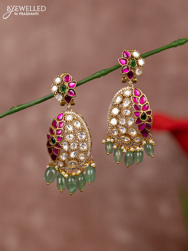 Jadau earrings floral deisgn with half jadau and half kundan stones model
