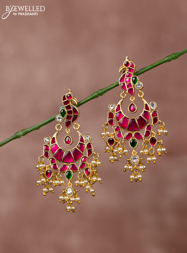 Jadau earrings peacock deisgn with jadau kundan stones and pearl hanging