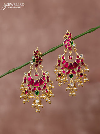 Jadau earrings peacock deisgn with jadau kundan stones and pearl hanging