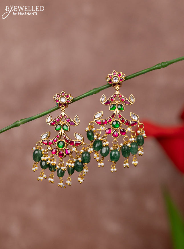 Jadau earrings floral deisgn with jadau kundan stones and green beads hanging