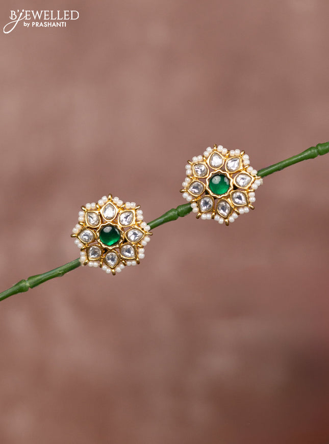 Jadau earrings floral deisgn with kundan stones surrounded with white beads