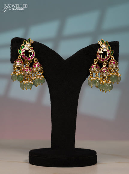Jadau screw type jhumka peacock design with kemp jadau kundan stones in pearl & mint green beads hangings