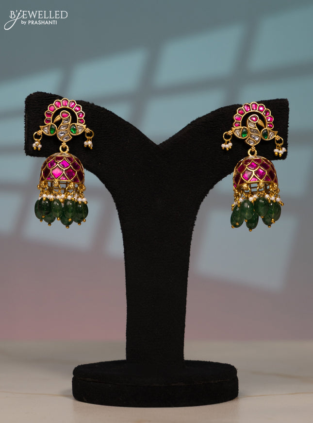 Jadau screw type jhumka peacock design with kemp jadau kundan stones in green beads hangings