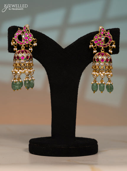 Jadau screw type jhumka peacock design with kemp jadau kundan stones in pearl & mint green beads hangings