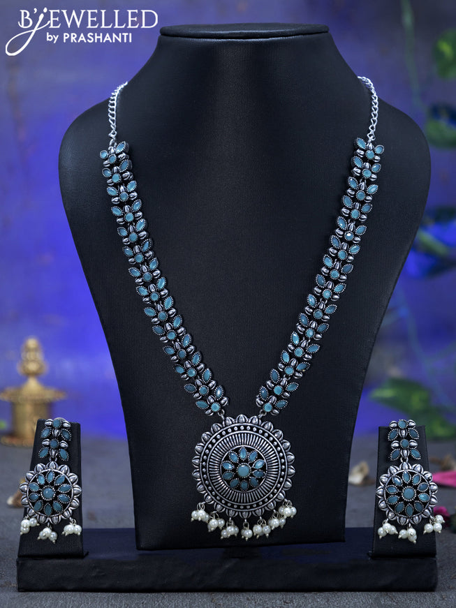 Oxidised necklace floral design with ice blue stones and pearl hangings