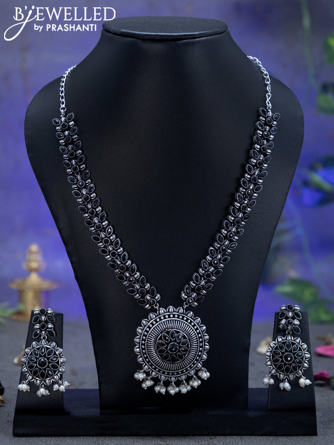 Oxidised necklace floral design with black stones and pearl hangings