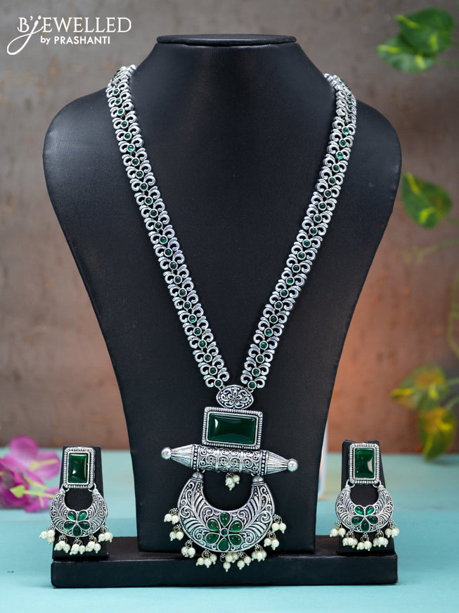 Oxidised long haaram floral design with emerald stones and pearl hangings