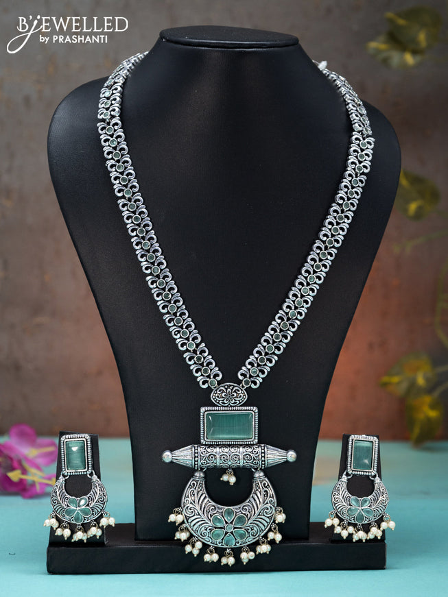 Oxidised long haaram floral design with mint green stones and pearl hangings