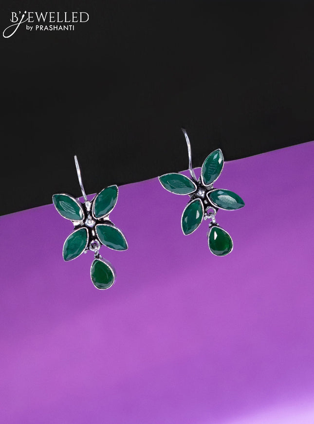 Oxidised hanging type earring with emerald stones