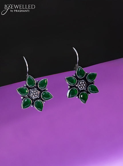 Oxidised hanging type earring floral design with emerald stones