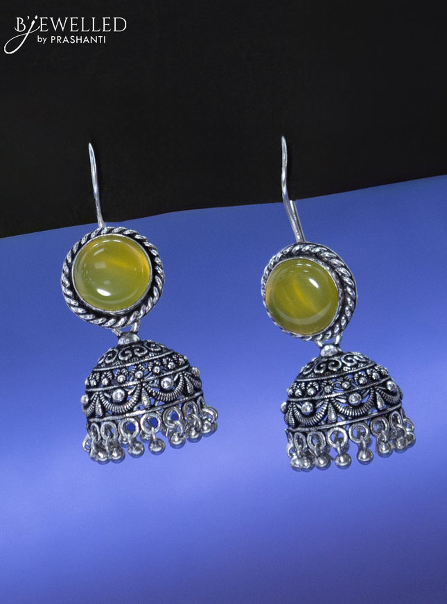 Oxidised hanging type jhumka with light green stone and hangings