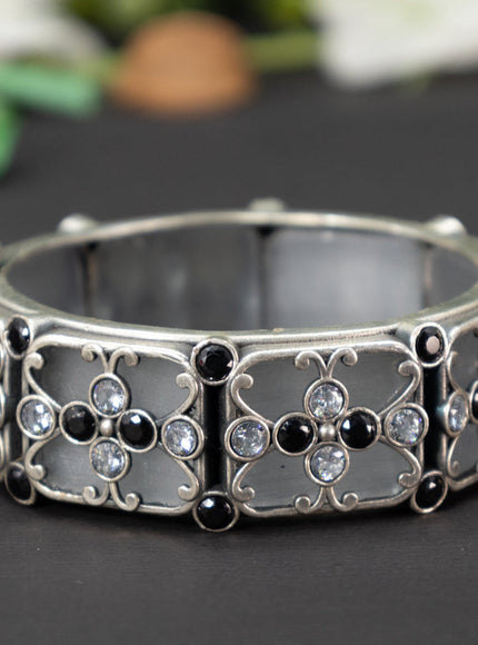 Oxidised screw type bangle with black and cz stones