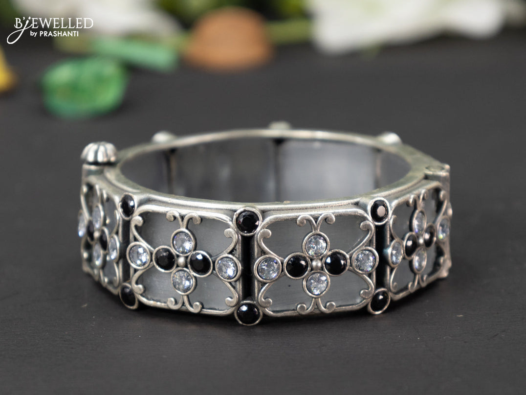 Oxidised screw type bangle with black and cz stones