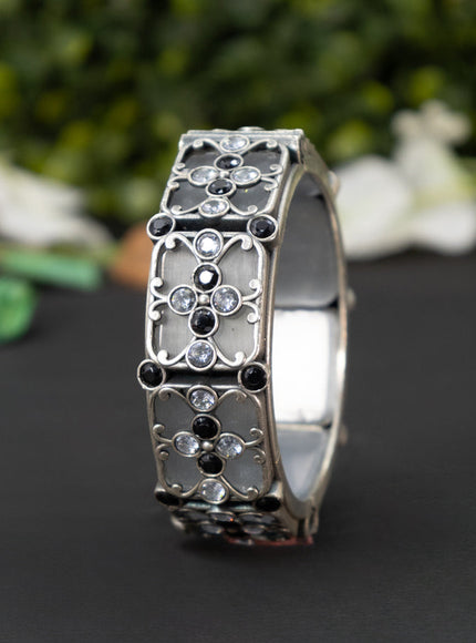 Oxidised screw type bangle with black and cz stones