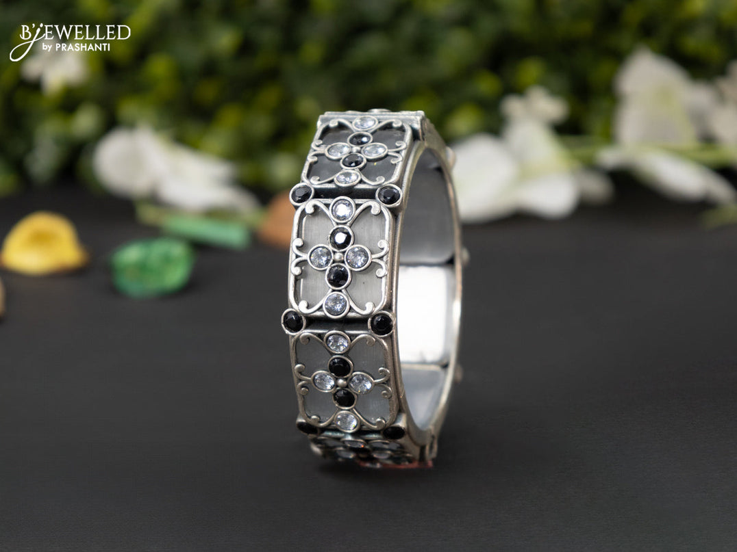 Oxidised screw type bangle with black and cz stones