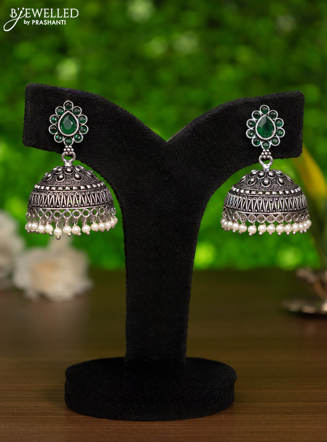 Oxidised jhumka with emerald stones and pearl hangings