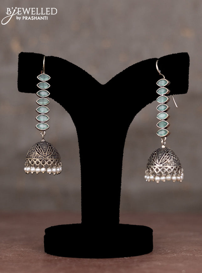 Oxidised hanging type jhumka with mint green stones and pearl hangings
